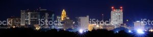 A city skyline at night stock photo.